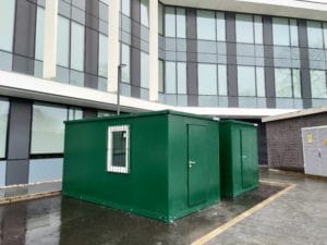 Two XPandaCabins, each featuring a standard door and window